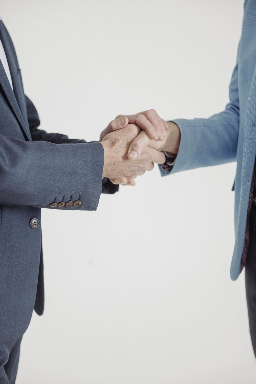 Close-up of two people shaking hands